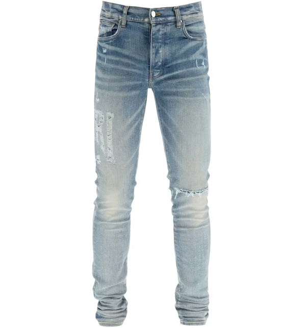 AMIRI Distressed Logo Skinny Jeans